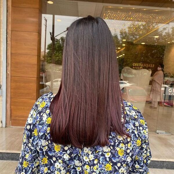 Black and Burgundy Balayage - a woman in a back view