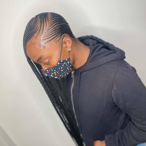 Black and Neat Lemonade Braids - a woman in a side view