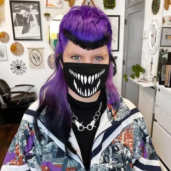 Black and Purple for Hunter Vibes Hairstyle - a woman wearing a face mask