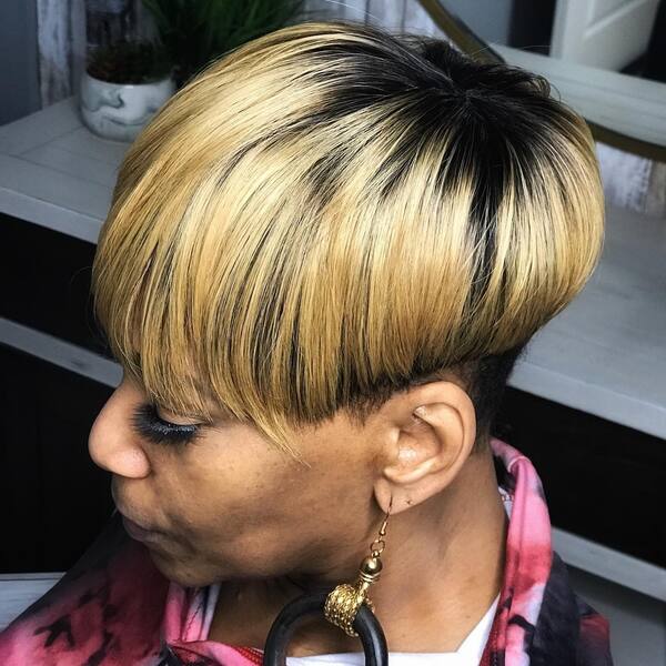 Blonde Pixie Hair with Undercut - a woman wearing a dress