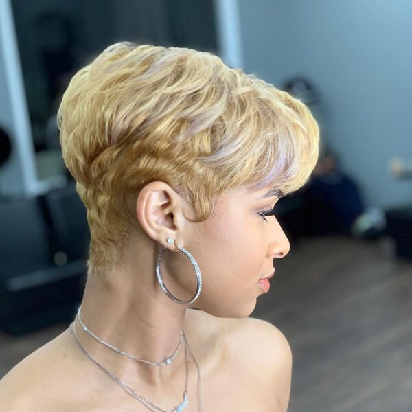 Blonde and Feathered Pixie Cut - a woman in a side view