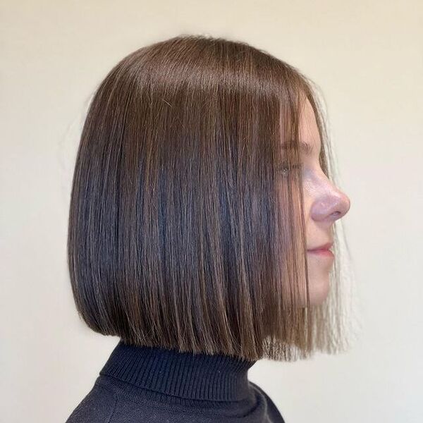 Blunt Bob with Caramel Highlight - a woman in a side view
