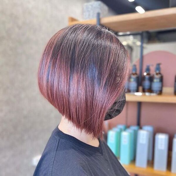 Blunt Bob with Rosy Gold Highlights - a woman in a side view