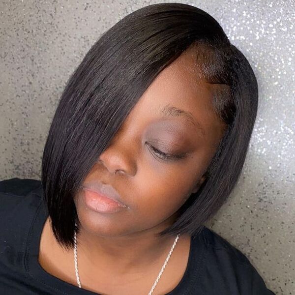 Bob Cut Hairstyle for Black Women - a woman wearing a black shirt