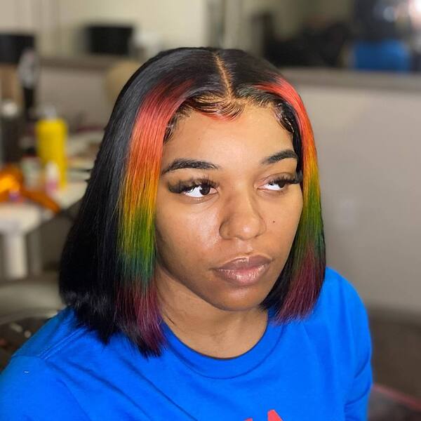 Bob Haircut with Rainbow Prism - a woman wearing a blue shirt