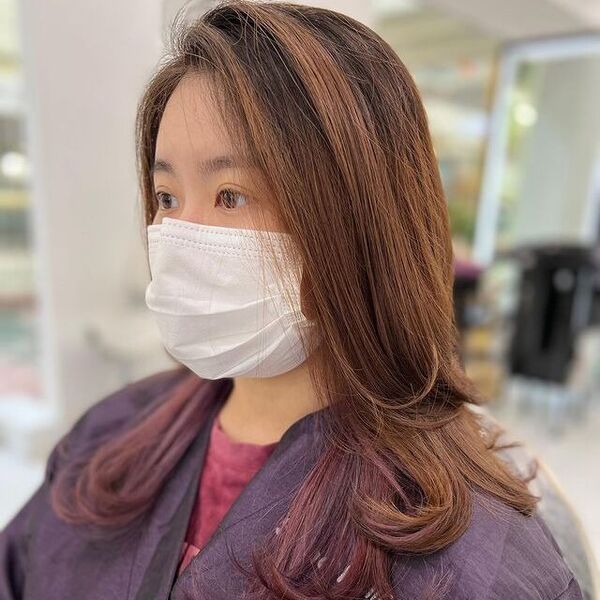 Brown Hair and Dark Purple Peek-a-Boo - a woman wearing a face mask