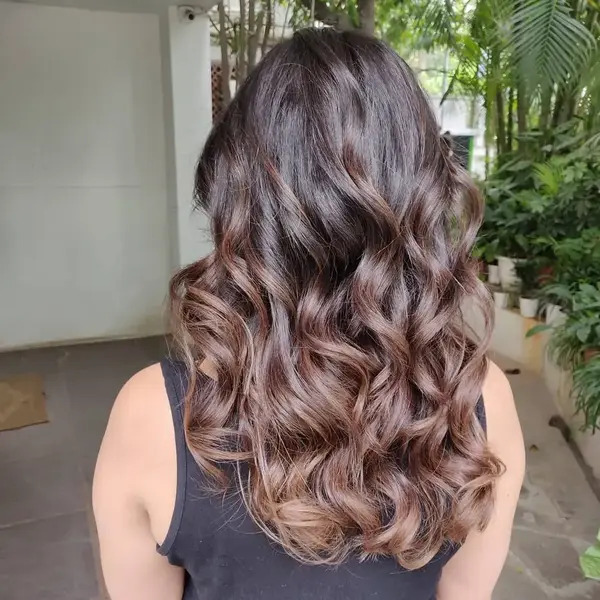 Brown Ombre Hair and Glossy Waves - a woman in a back view