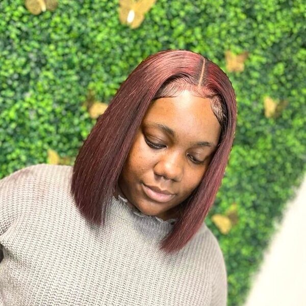 Burgundy Hair for Blunt Bob Cut - a woman wearing a jacket