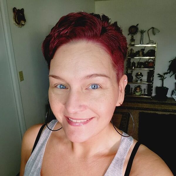 Burgundy in Sweet Pixie Hair - a woman wearing a sleeveless