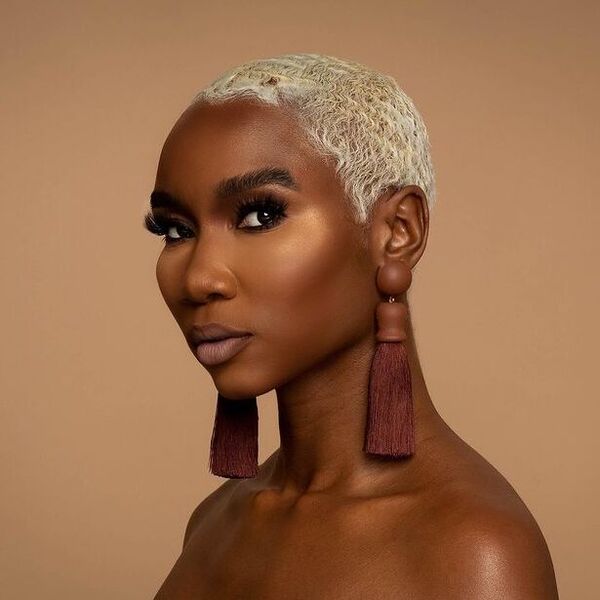 Buzz Cut and Blonde Hair - a woman wearing an earrings