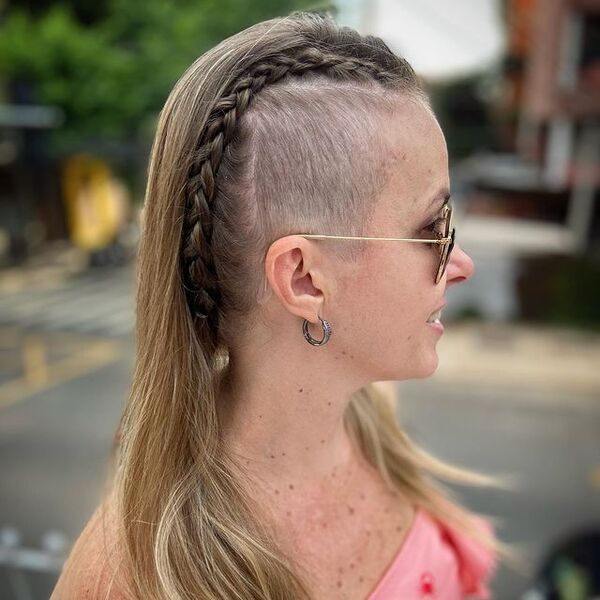 Charm Braid with Undercut - a woman wearing a sunglasses