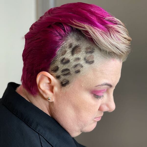 Cheetah Markings and Deep Pink Hair - a woman in a side view