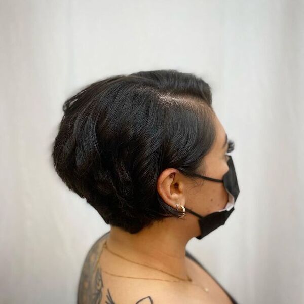 Chic Mid-Length Haircut - a woman wearing a face mask