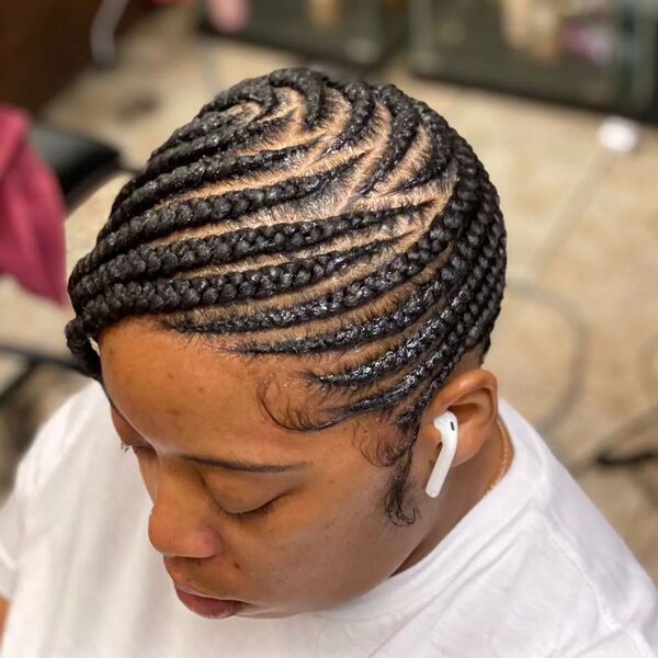 Conclave Lemonade Braids - a woman wearing a white shirt