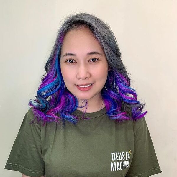 Cosmic Peek-a-Boo on Gray Hair - a woman wearing green shirt