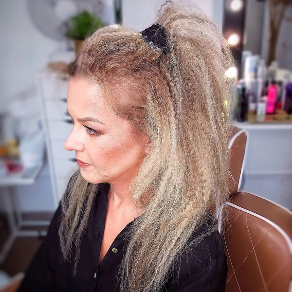Crimp Accents Throughout - a woman in a side view