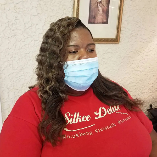 Crimped and Curled Style - a lady wearing a face mask