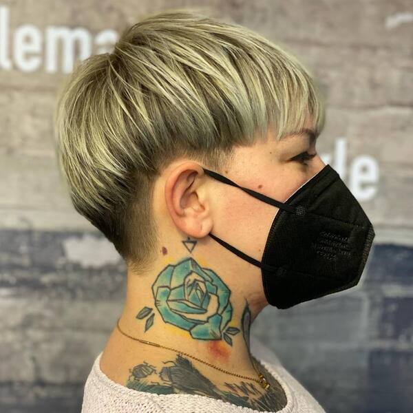 Crop Fringe Pixie Undercut - a woman wearing a face mask