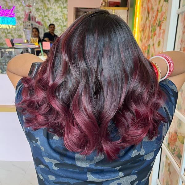 Crosa Red Balayage Burgundy Hair - a woman in a back view