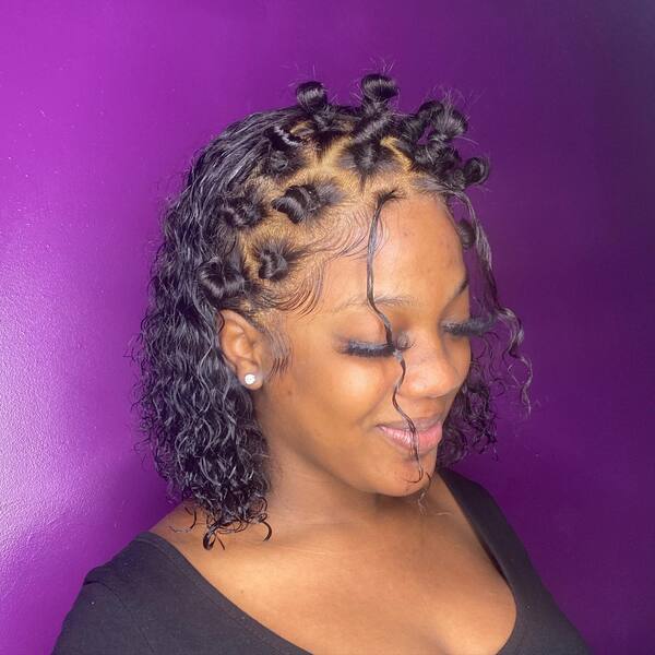 Curly Bob with Braided Knots and Tendrils - a woman in a side view