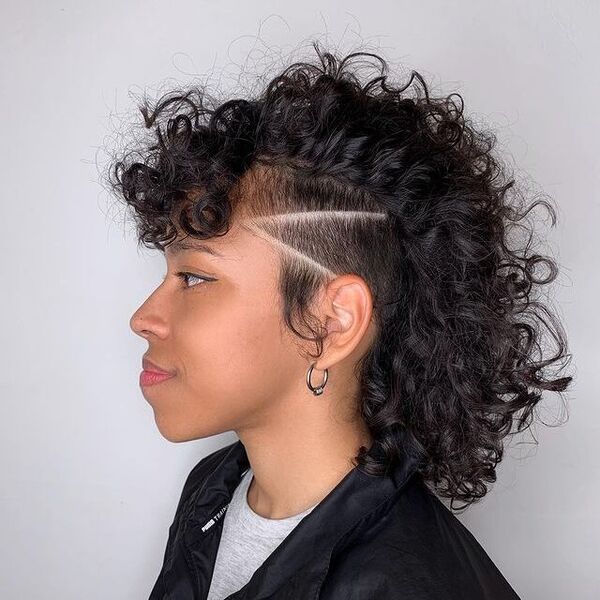 Curly Mohawk Undercut and Style - a woman in a side view