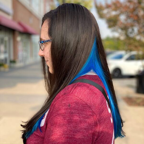 Dark Brown Hair with Vibrant Cobalt Blue Peek-a-Boo - a woman in a side view