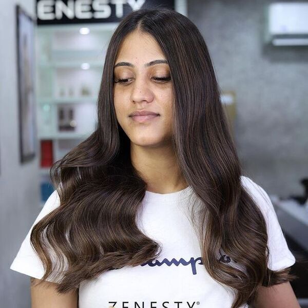 Dark Brown Highlights for Wavy Hair - a woman wearing a white dress