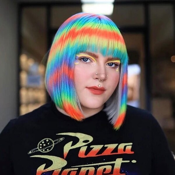 Dazzling Rainbow Blunt Bob Hairstyle - a woman wearing a shirt