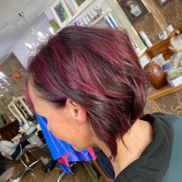 Deep Burgundy and Highlights in Textured Bob - a woman in a back view