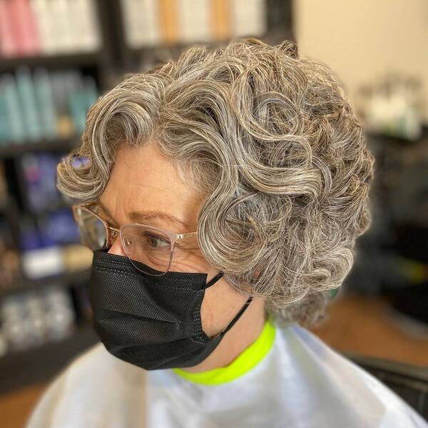 Deva Pixie Haircuts for Older Women - a woman wearing a black face mask