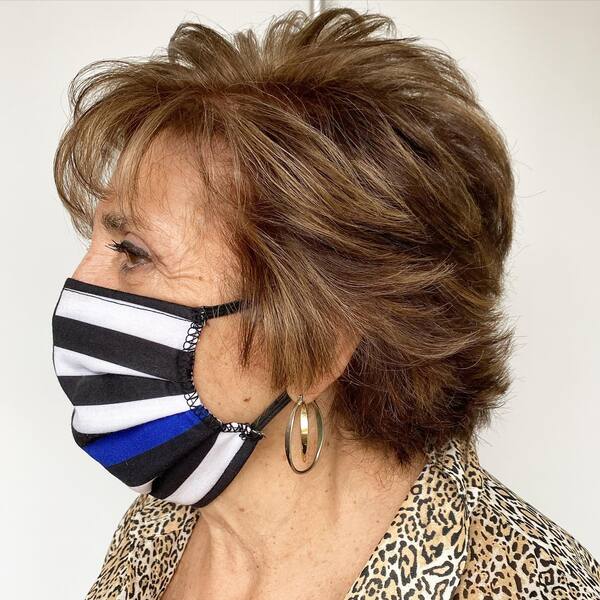Feathered Cut for Older Women - a woman wearing a face mask