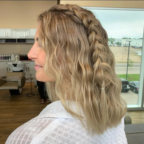 Parted Fishtail Braid with Crimped Hair - a woman in a back view