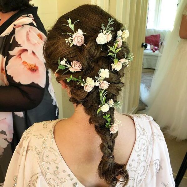 French Braids with Tucked Flower - a girl in a back view