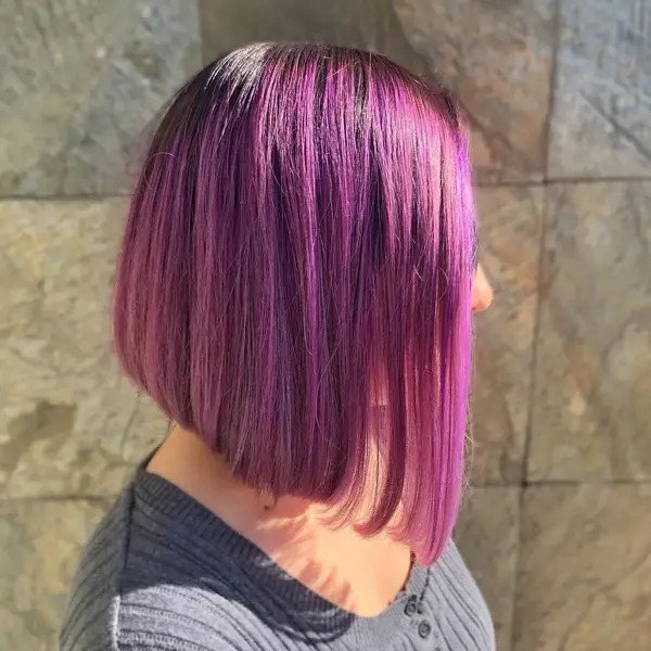 Fresh Cut with Purple and Black Root Hair - a woman in a side view
