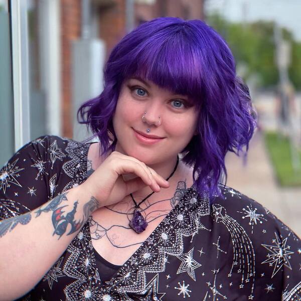 Fresh Purple in Mid-Length Cut Wavy Hair - a woman wearing a dress