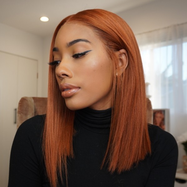 Ginger Hair Color for Long Bob Cut - a woman wearing a turtle neck