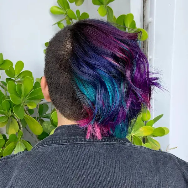 Half Shaved and Half Vibrant Colors - a woman in a back view