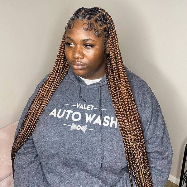 Half-and-Half Styled Braids - a woman wearing a gray jacket