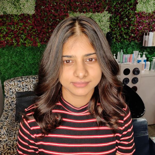 Hot Toffee Hair Highlights - a woman wearing striped dress