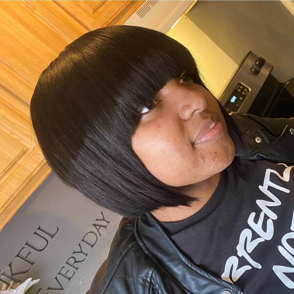 Layered Bob Cut with Razored Bangs - a woman in a side view