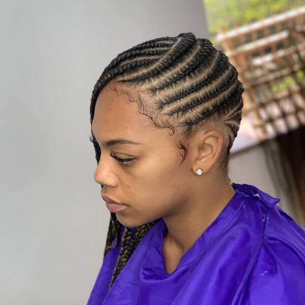 Cornrows Lemonade Braids and Baby Hair - a woman wearing a blue cape