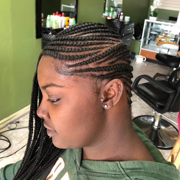 Lemonade Small Box Braids - a woman wearing a green jacket