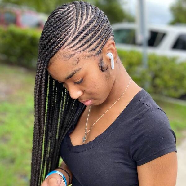 Lemonade with Beautiful Cornrows - a woman wearing a black blouse