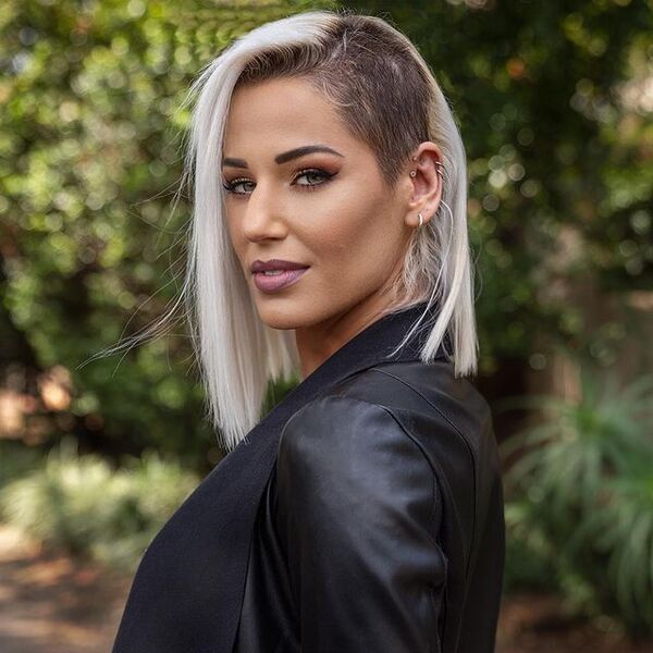 Long Bob Haircut with Side Shaved - a woman wearing a leathered jacket