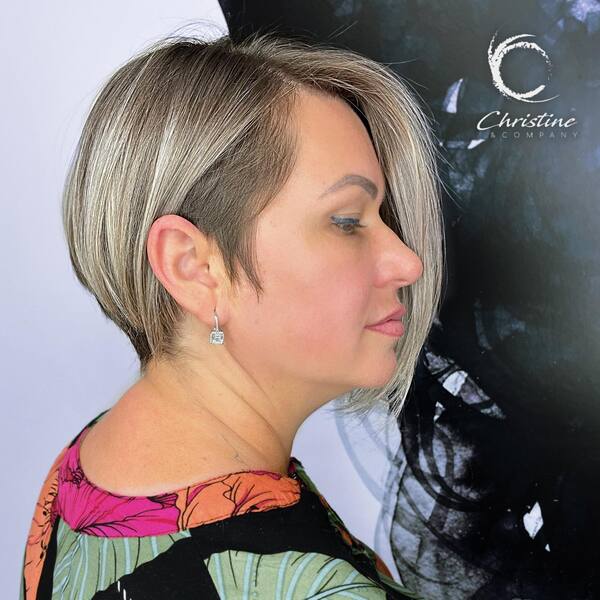 Low Maintenance Side-Parted Haircut - a woman wearing a dress