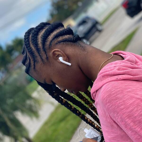 Medium Size in Lemonade Braids - a woman wearing a pink jacket