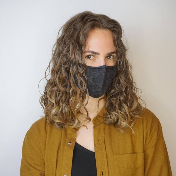 Mid-Length Bouncy Fresh Curls - a woman wearing a face mask