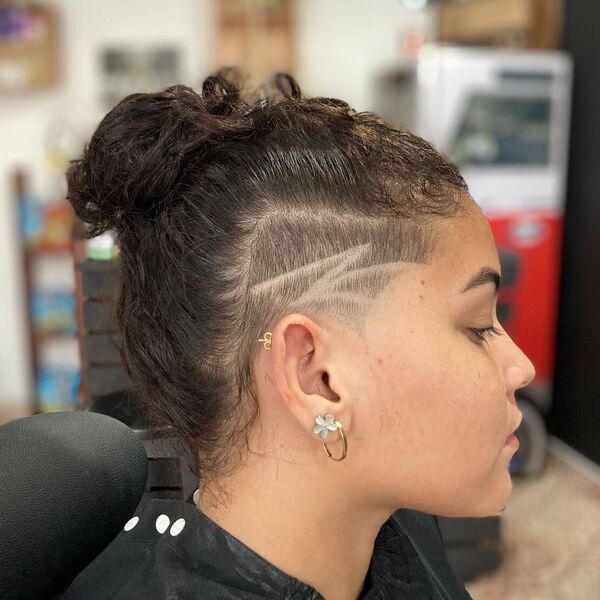 Middle Bun and Side Cut Style - a woman in a side view