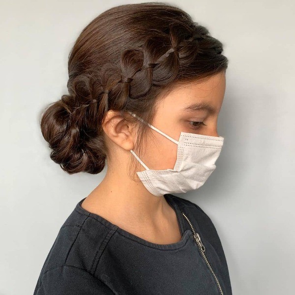 Milkmaid Braid Hairstyle - a girl wearing a white face mask