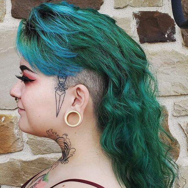 Mullet Undercut in Emerald Green - a woman in a side view